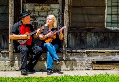 ukulele due sitting on a porch