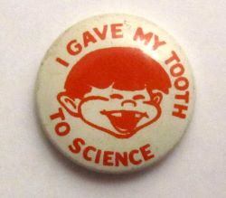 image of a pin stating I gave my tooth to science