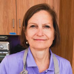 image of a woman in a lavender blouse