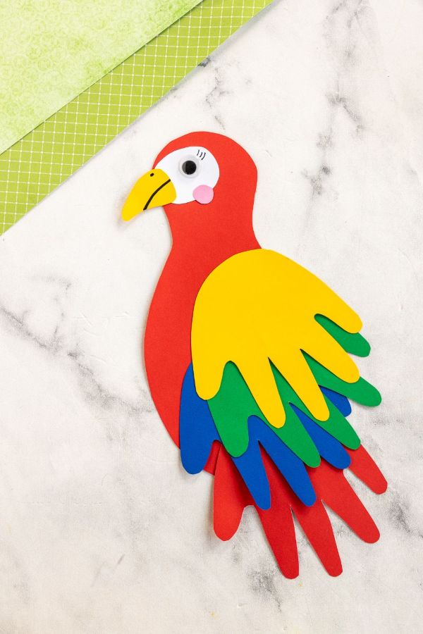a parrot made out of colored construction paper