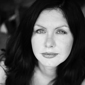 Black and white image of a woman with dark hair.