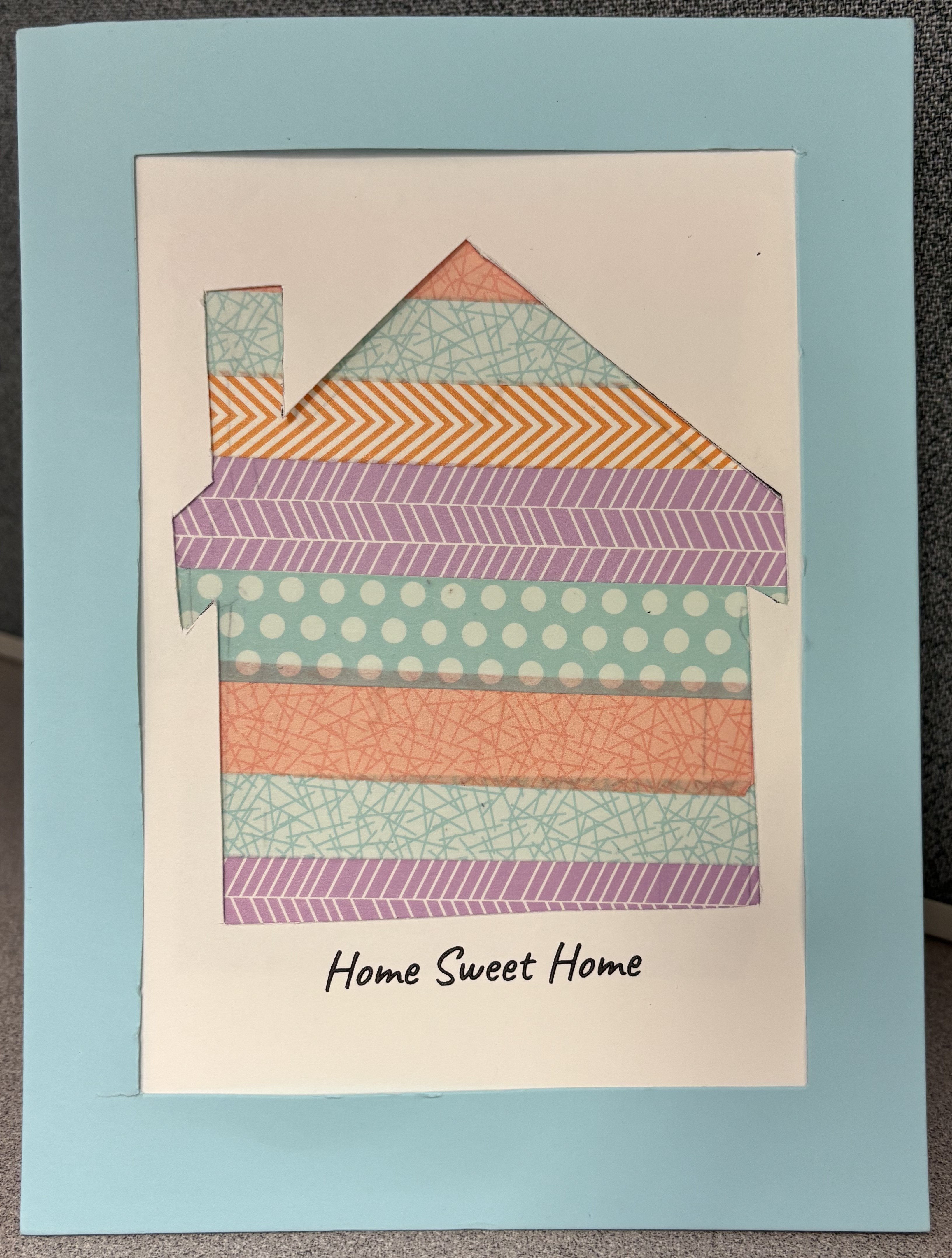 Craft in the shape of a house with washi tape