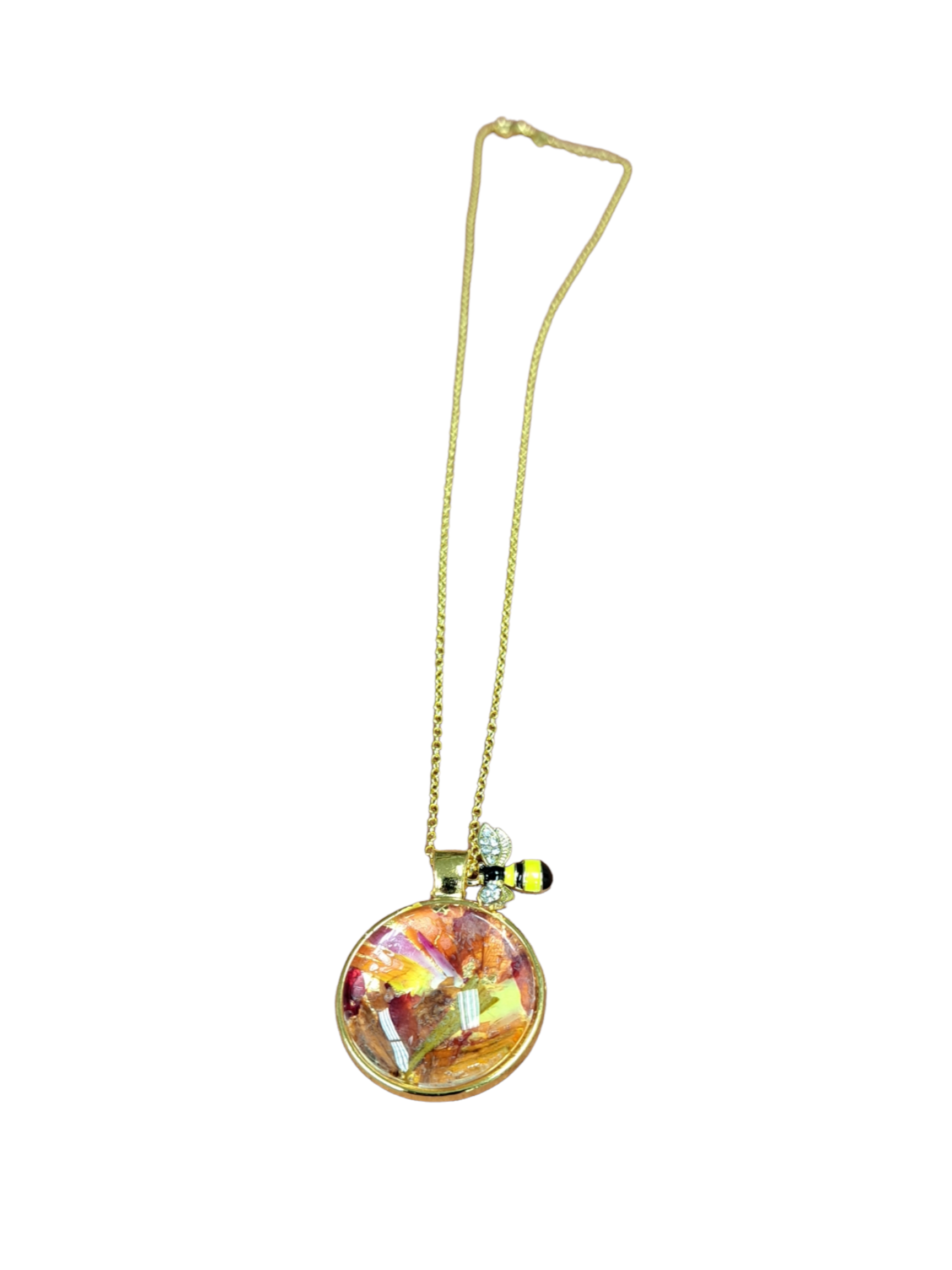 Glass pendent with flower petals inside and bee charm