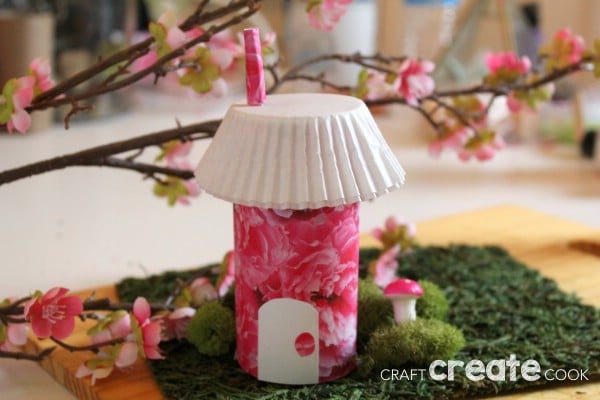 pink and white fairy house made from paper