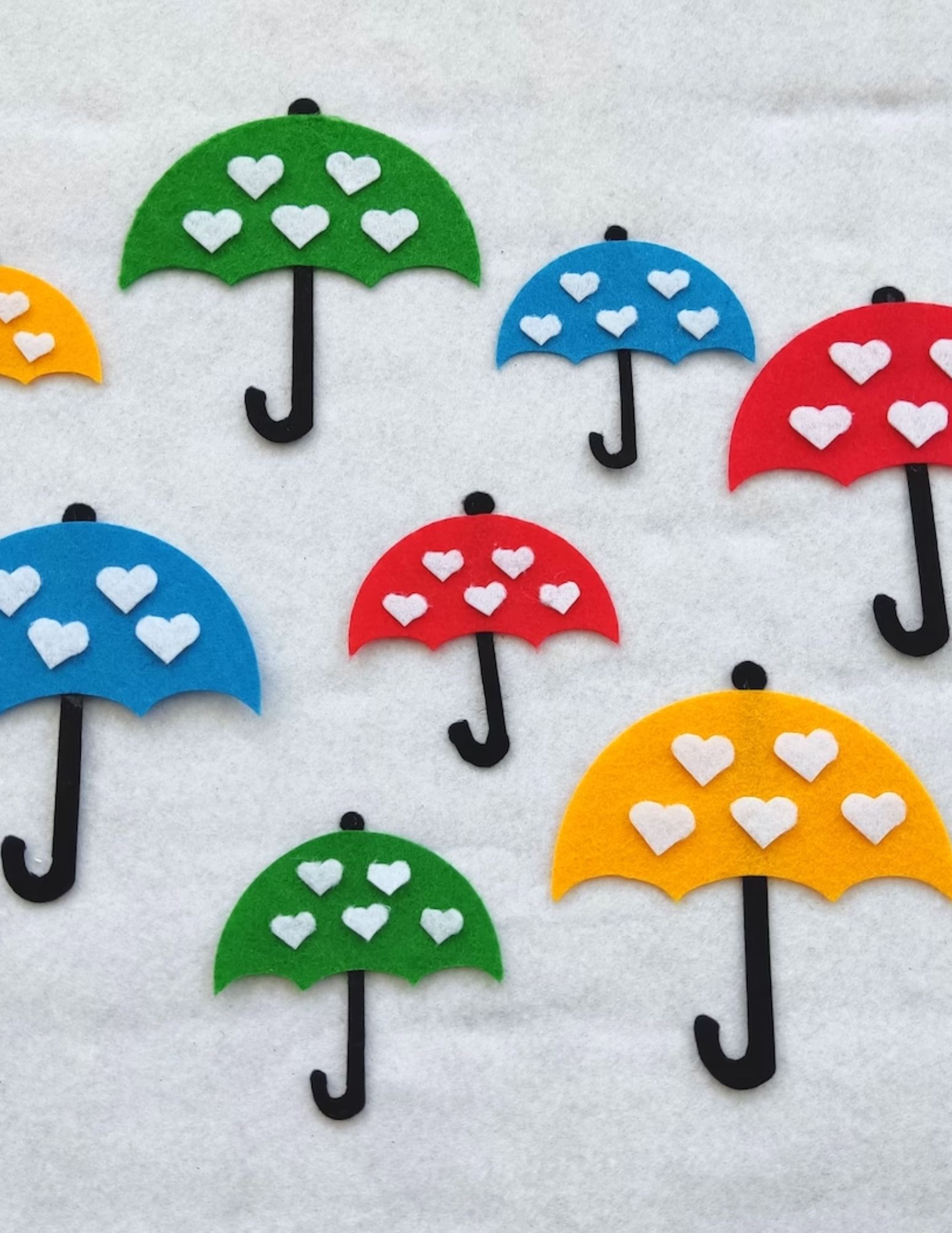 Close up of several felt umbrellas