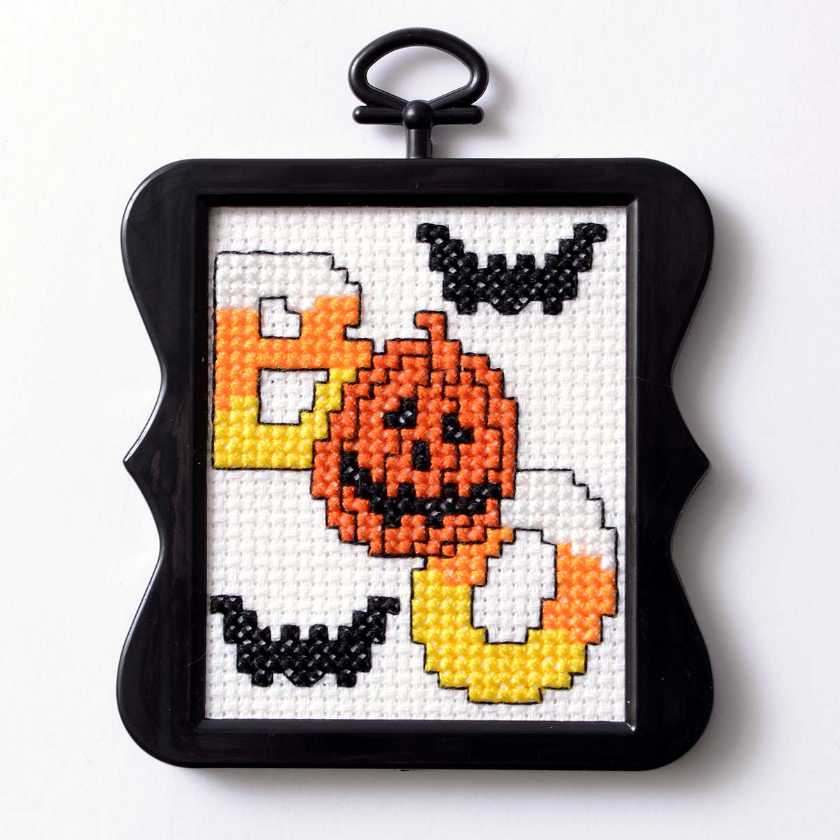 Halloween pattern with "BOO" written with a pumpkin