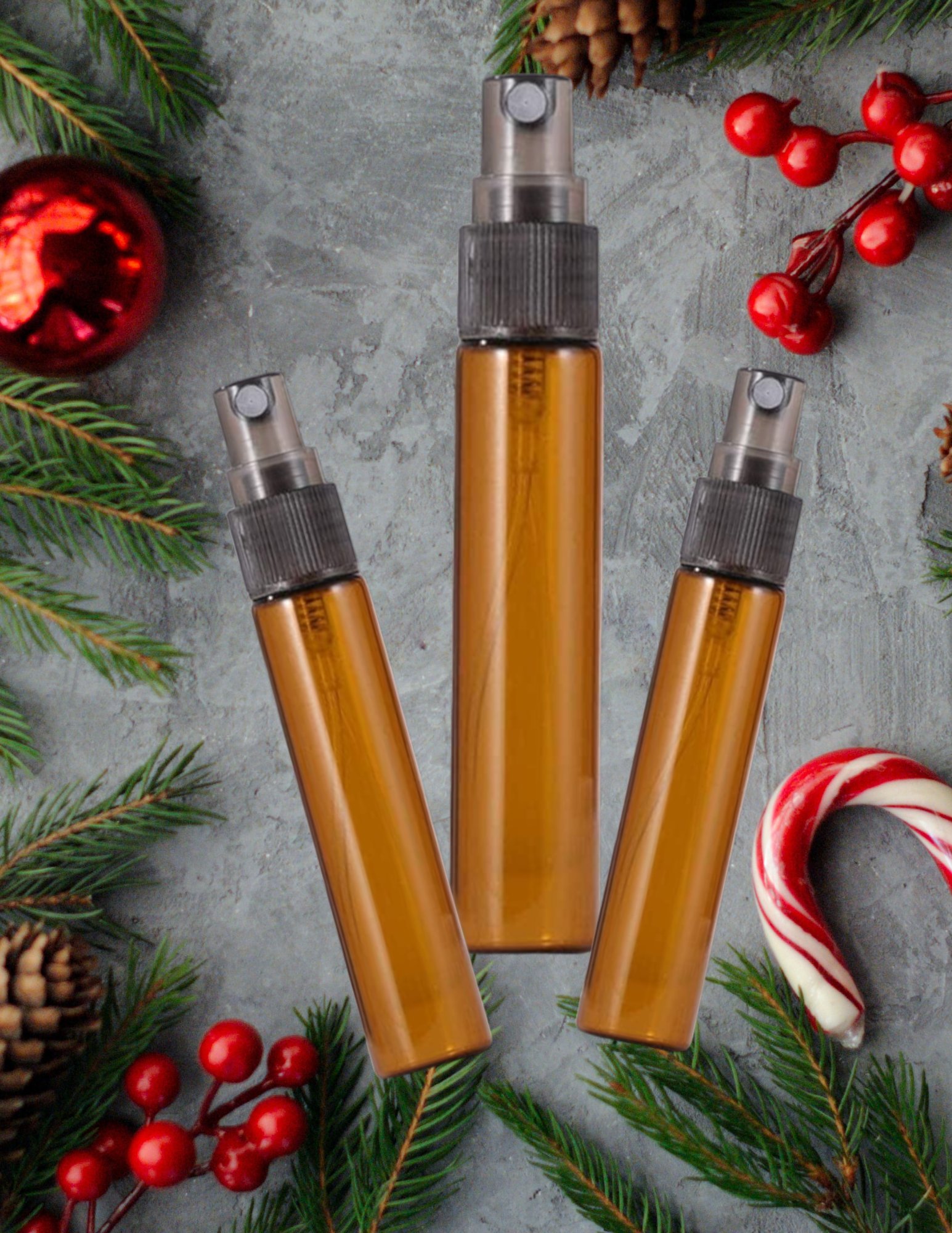 Three perfume vials on a winter holiday background