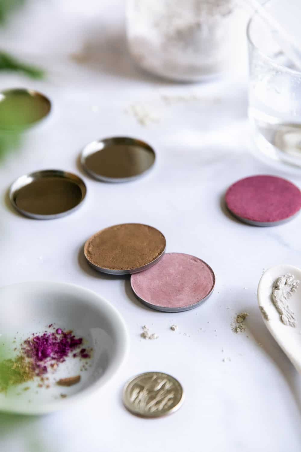 a couple homemade eye shadows in little containers