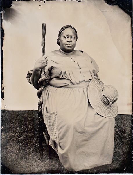 black and white picture of an African American woman in an 1800s cook's dress 