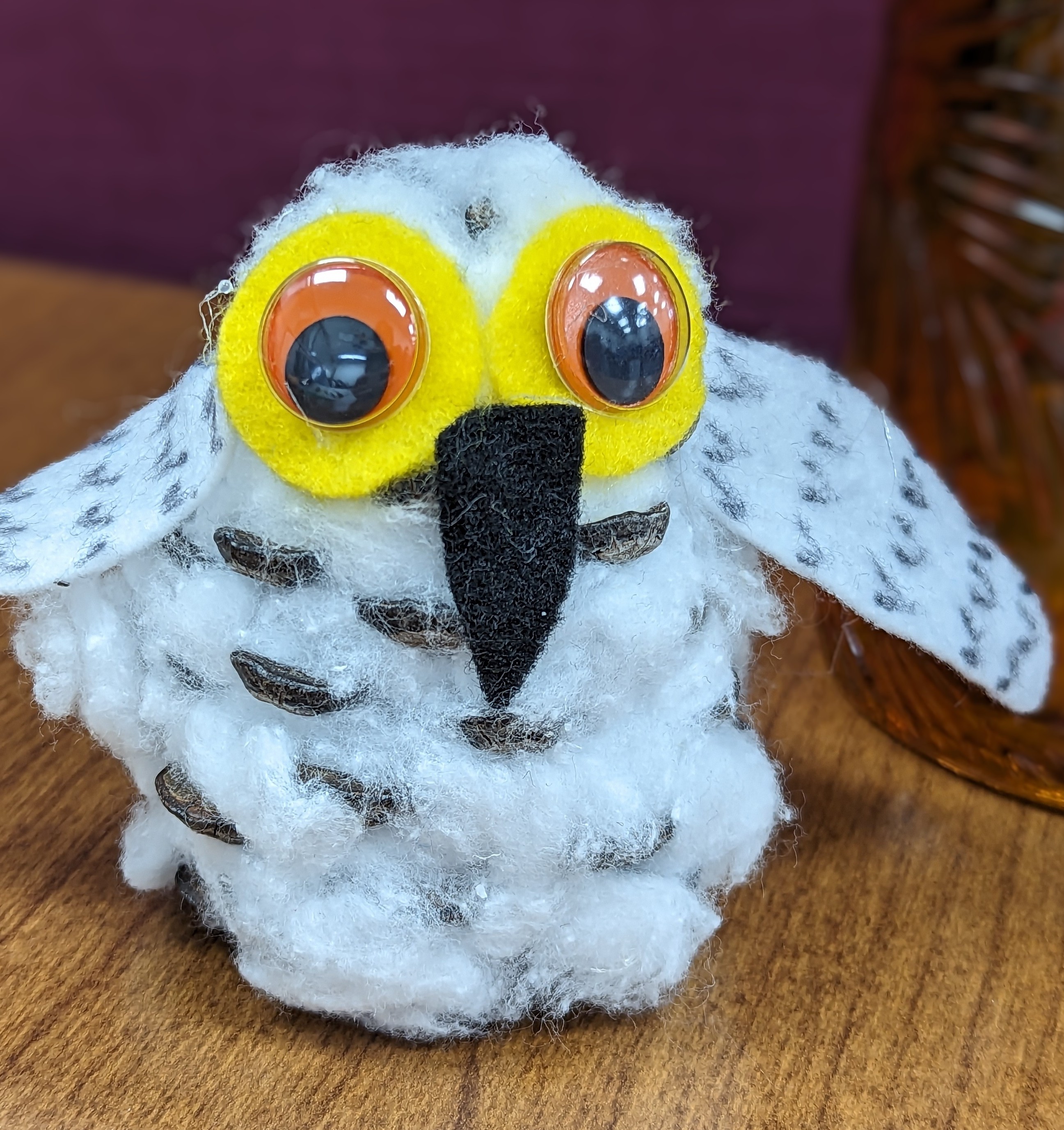 snowy owl pinecone