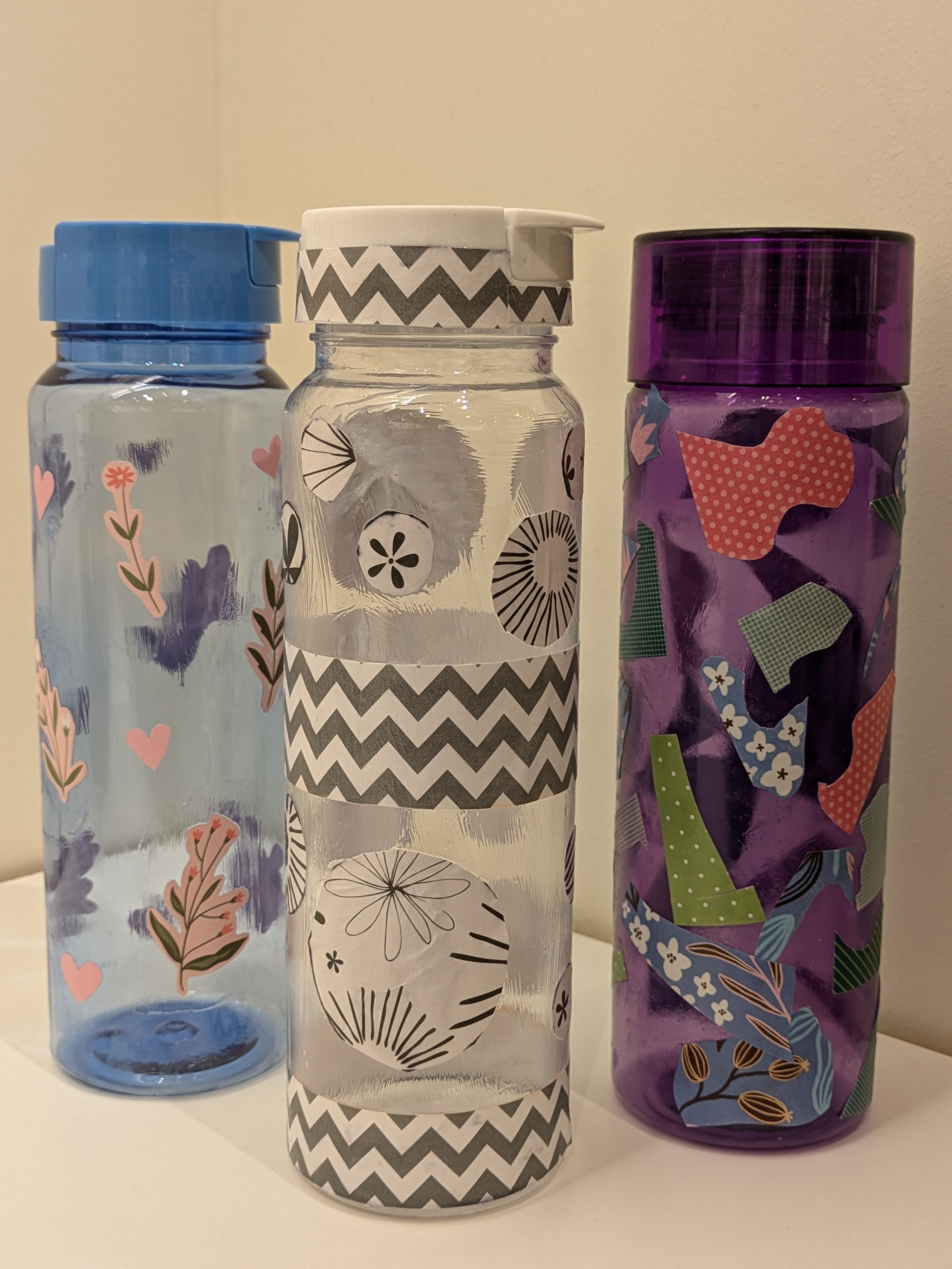 samples of 3 decorated water bottles