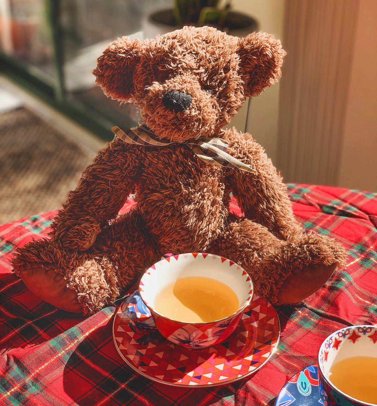 Teddy bear having tea