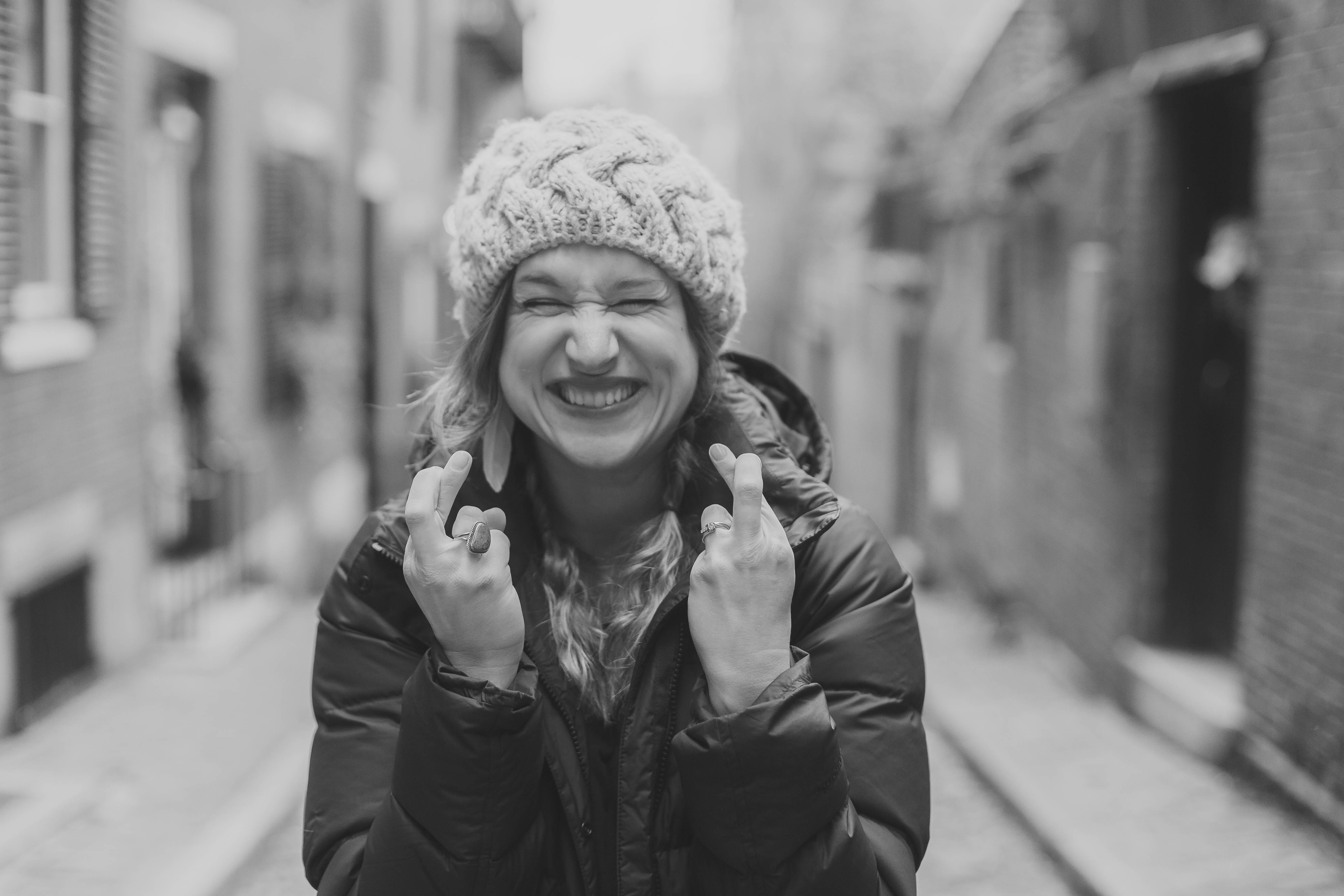 woman crossing fingers for good luck