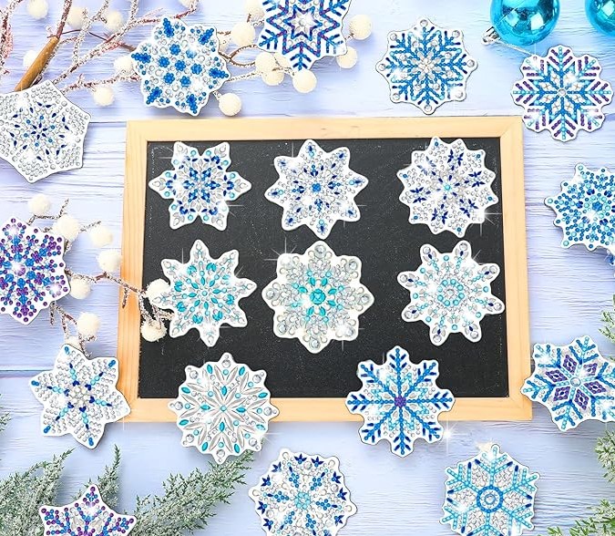 Image of snowflake magnets created using diamond painting technique.