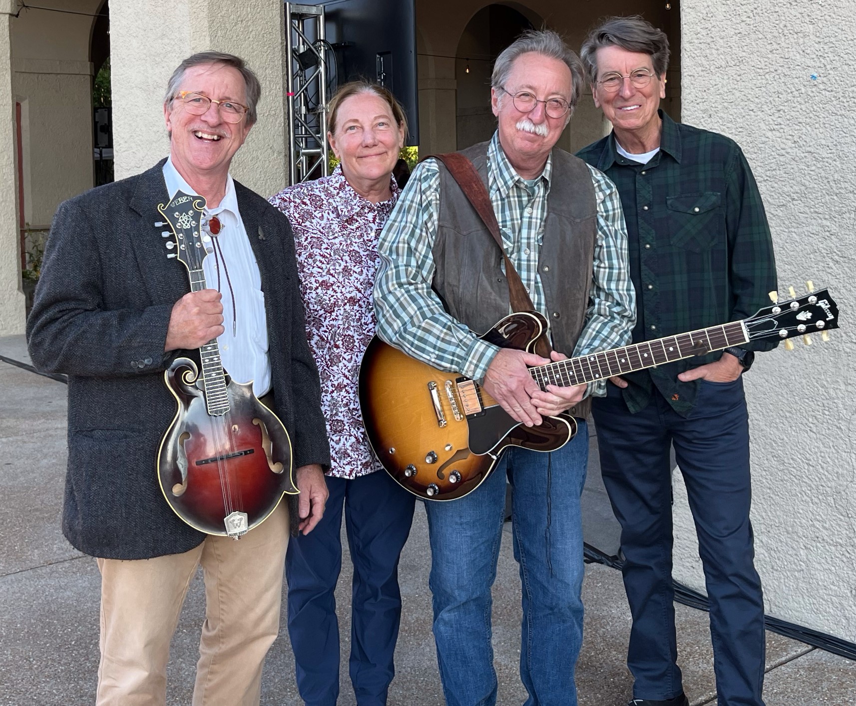 four musicians of the buckhannon brothers band standing