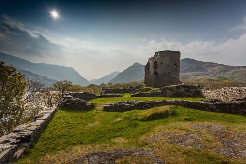 Castle Ruins with hills and mountains in the background