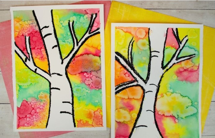 Two examples of birch trees painted with a fall-themed watercolor background.