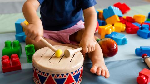 Toddler playing drum