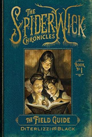 Two boys and one girl examine an old book