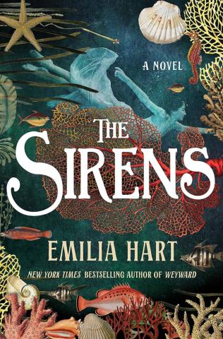 The cover shows an underwater scene with fish, shells, coral, and more in muted tones of pink, yellow, and off white. A blue watery part takes up the top third of the cover where there is the image of a woman in a gauzy dress floating horizontally. The title, The Sirens, is prominently displayed in the very middle of the cover under the floating woman. 