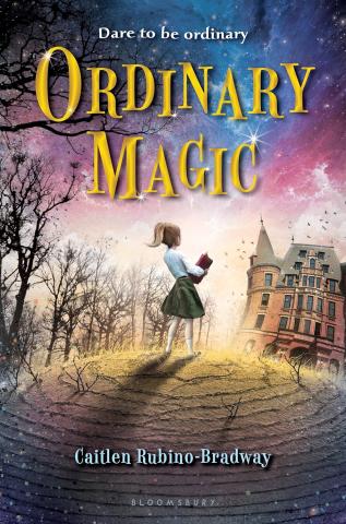 A girl holding a book stands outside the edge of the woods. A giant Victorian brick building stands in the distance.