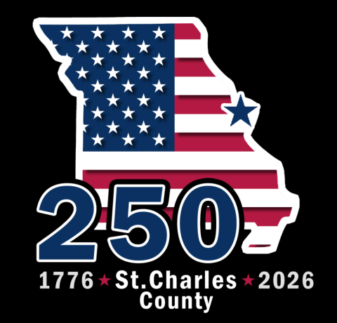 The state of Missouri with the American flag inside it. The number 250 on top of Missouri. Text underneath states "1776. St. Charles County. 2026"