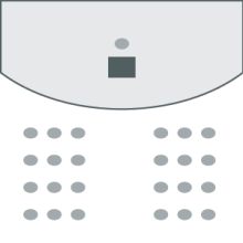 380 chairs set up facing the stage in Room M